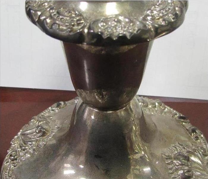 tarnished and soot covered silver candle holder at the SERVPRO of Southeast Memphis warehouse