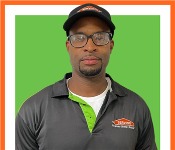 Demetrius, SERVPRO employee, cut out and set against a green backdrop