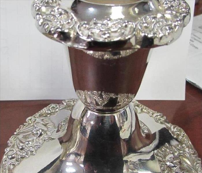 clean, like new, sparkly silver candlestick, cleaned by SERVPRO technicians, close up in a warehouse